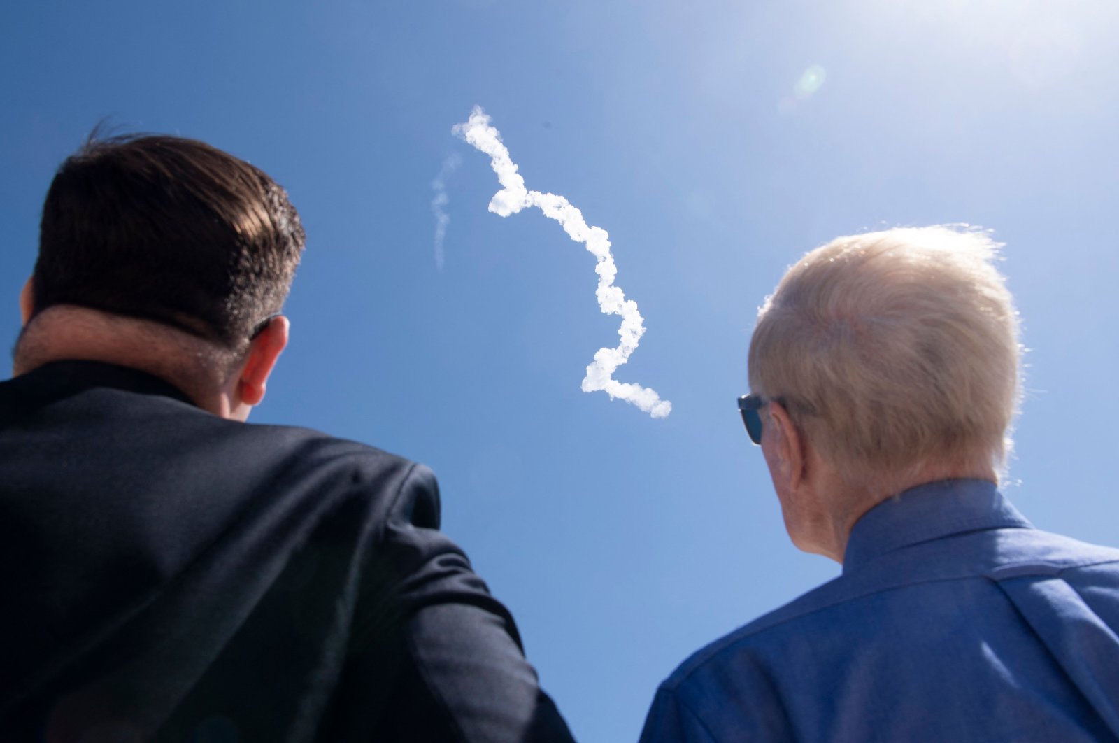 NASA Deputy Chief of Staff Bale Dalton (L) and NASA Administrator Bill Nelson watch the launch of a SpaceX Falcon 9 rocket, from the press site at NASA’s Kennedy Space Center in Florida, U.S., April 8, 2022. (NASA via AFP)