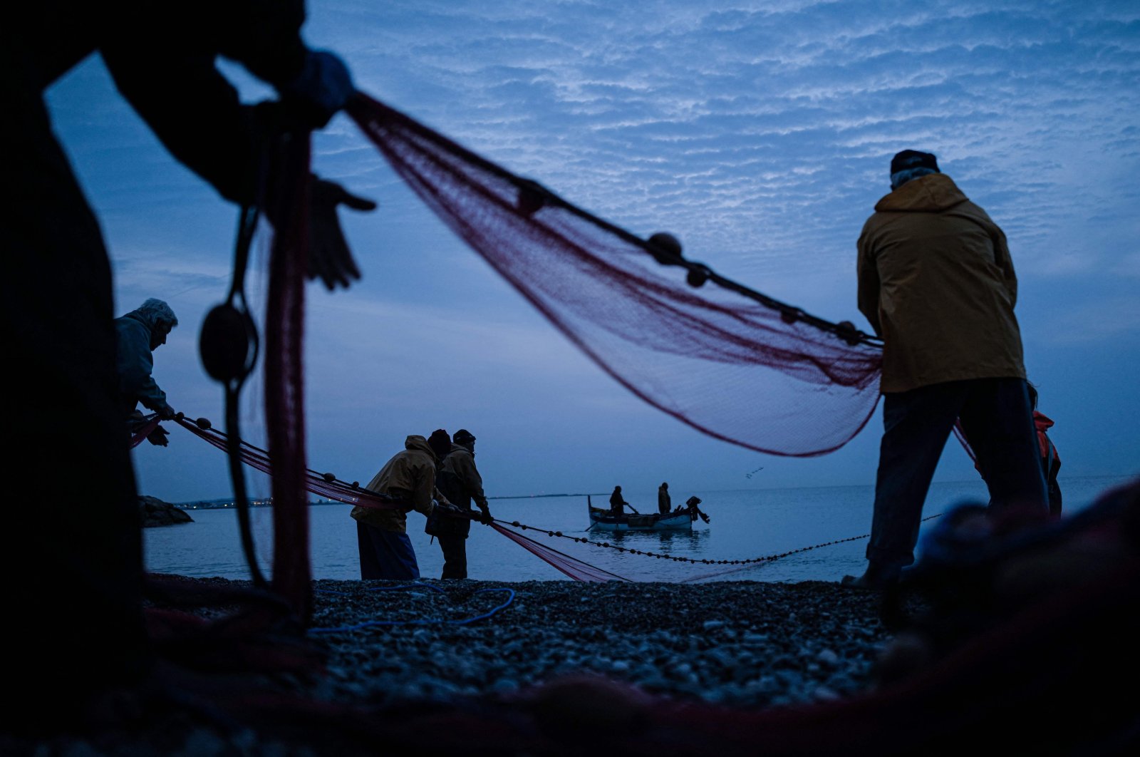 Fishermen take part in the traditional Poutine fishing in Cagnes-sur-Mer, southeastern France, March 29, 2022. (AFP Photo)