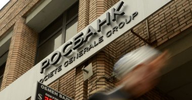 A pedestrian walks past an office of Rosbank, Societe Generale&#039;s Russian unit, in Moscow, Russia, May 15, 2013. (AFP Photo)