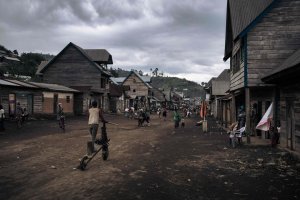 People walk down the main street of Muheto, a village on the outskirts of Masisi Center, North Kivu province, eastern Democratic Republic of Congo, March 28, 2022. (AFP  Photo)