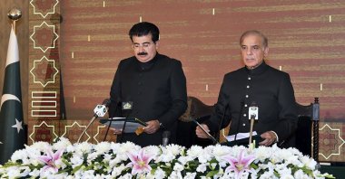 President of Pakistan&#039;s Senate Sadiq Sanjrani (L) administers the oath of office to newly-elected Pakistani Prime Minister Shahbaz Sharif during a ceremony at Presidential Palace, in Islamabad, Pakistan, April 11, 2022. (Press Information Department via AP)