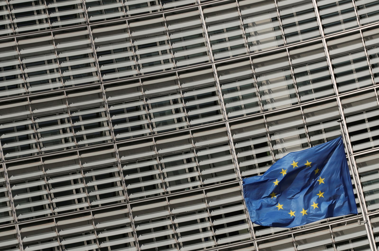 A European Union flag flutters outside the European Commission headquarters in Brussels, Belgium, March 24, 2021. (Reuters File Photo)