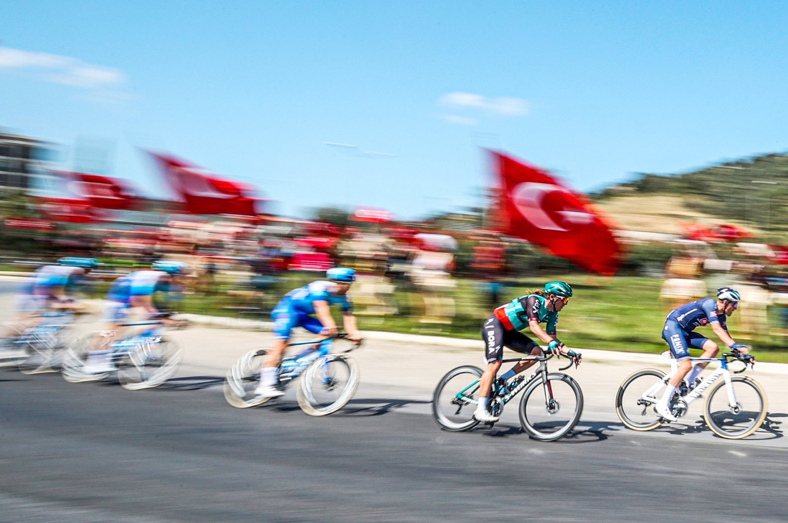 A group of cyclists is seen during the first stage of the 57th Presidential Cycling Tour of Türkiye, Bodrum, Turkey, April 10, 2022. (AA Photo)