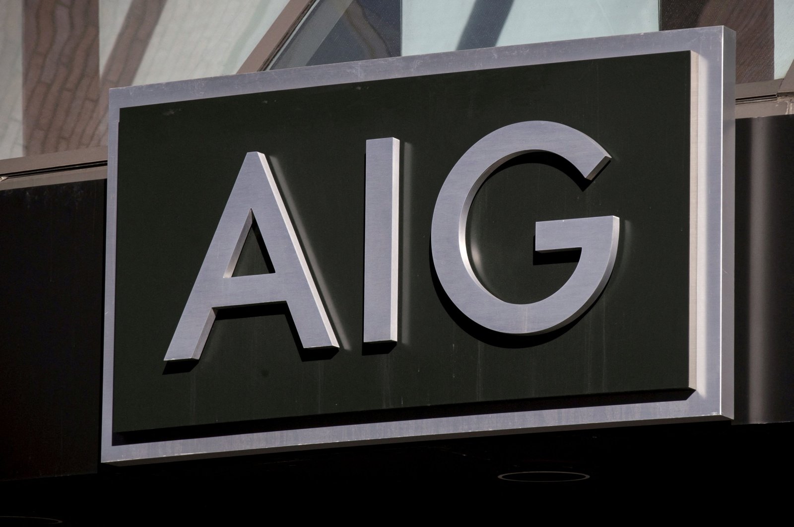 The AIG logo is seen on its building in New York&#039;s financial district, New York, U.S., March 19, 2015. (Reuters Photo)