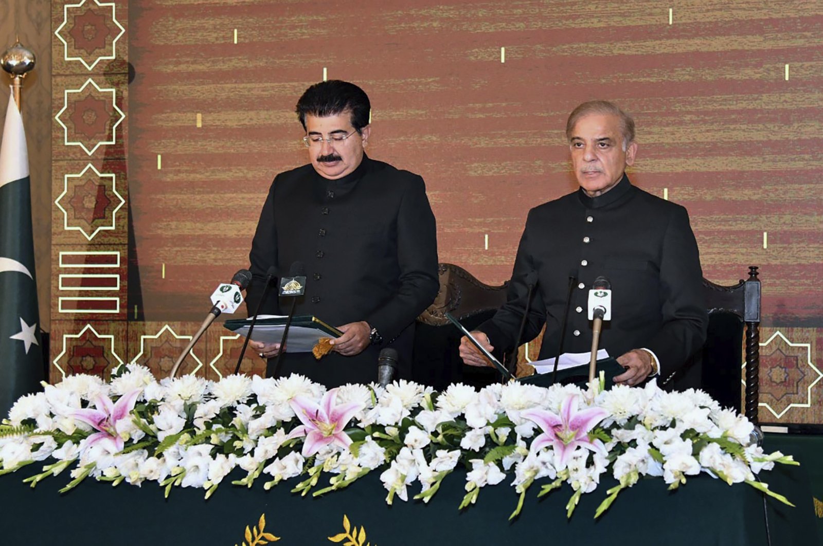 President of Pakistan&#039;s Senate Sadiq Sanjrani (L) administers the oath of office to newly-elected Pakistani Prime Minister Shahbaz Sharif during a ceremony at Presidential Palace, in Islamabad, Pakistan, April 11, 2022. (Press Information Department via AP)