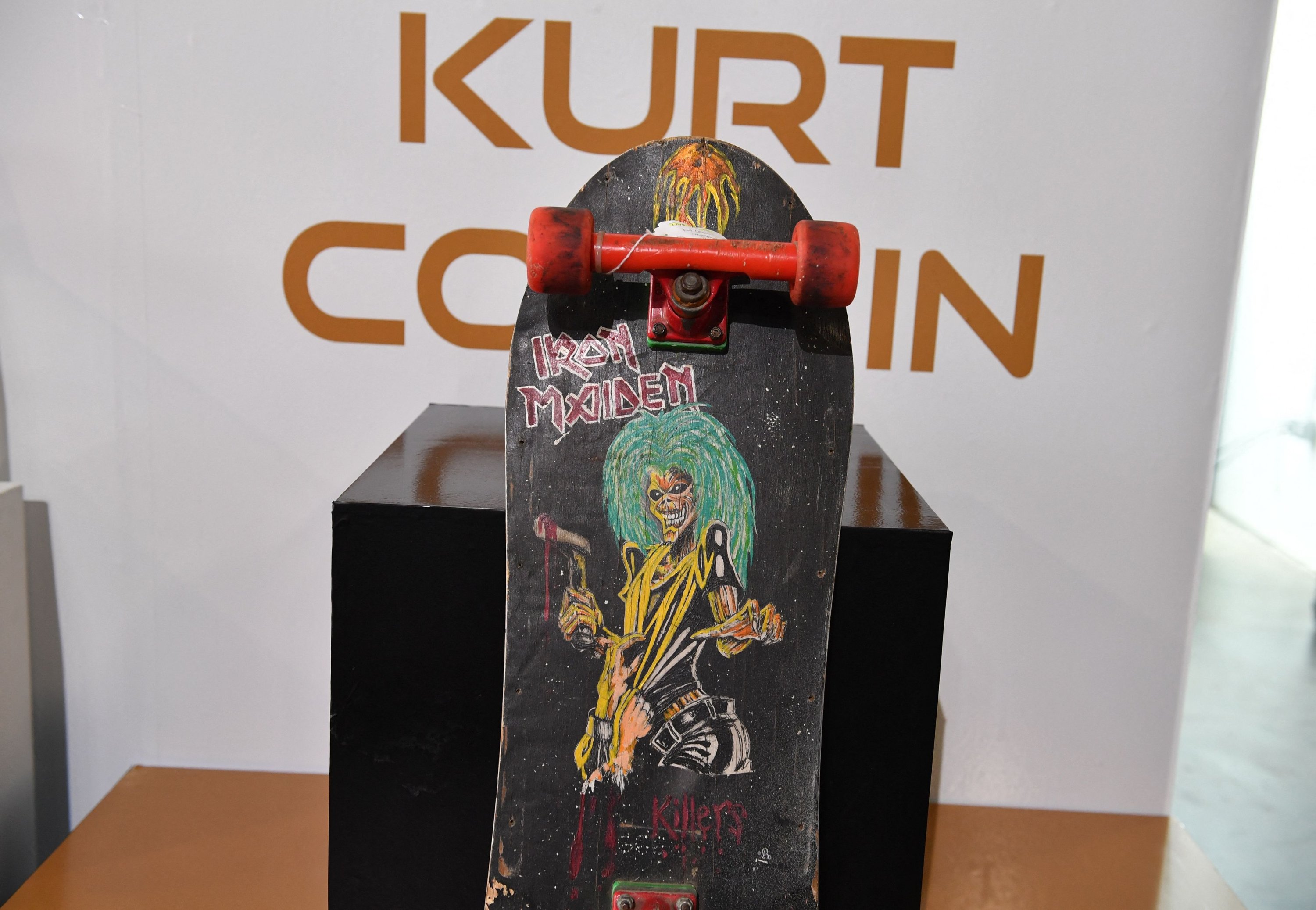 A skateboard owned and hand decorated by Kurt Cobain is displayed at the media preview of the upcoming 