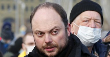 Russian opposition activist Vladimir Kara-Murza arrives to lay flowers near the place where Russian opposition leader Boris Nemtsov was gunned down, in Moscow, Russia, Saturday, Feb. 27, 2021. (AP Photo)