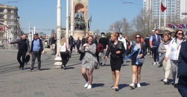 People walk in Taksim Square, in Istanbul, Turkey, April 9, 2022. (DHA Photo)