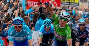 Belgian rider Jasper Philipsen (R) celebrates winning the 3rd stage of the Tour of Türkiye, April 10, 2022.