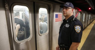 A police officer watches a train pull out of the Times Square subway station in New York, U.S., Sept. 17, 2014.  (AP Photo)