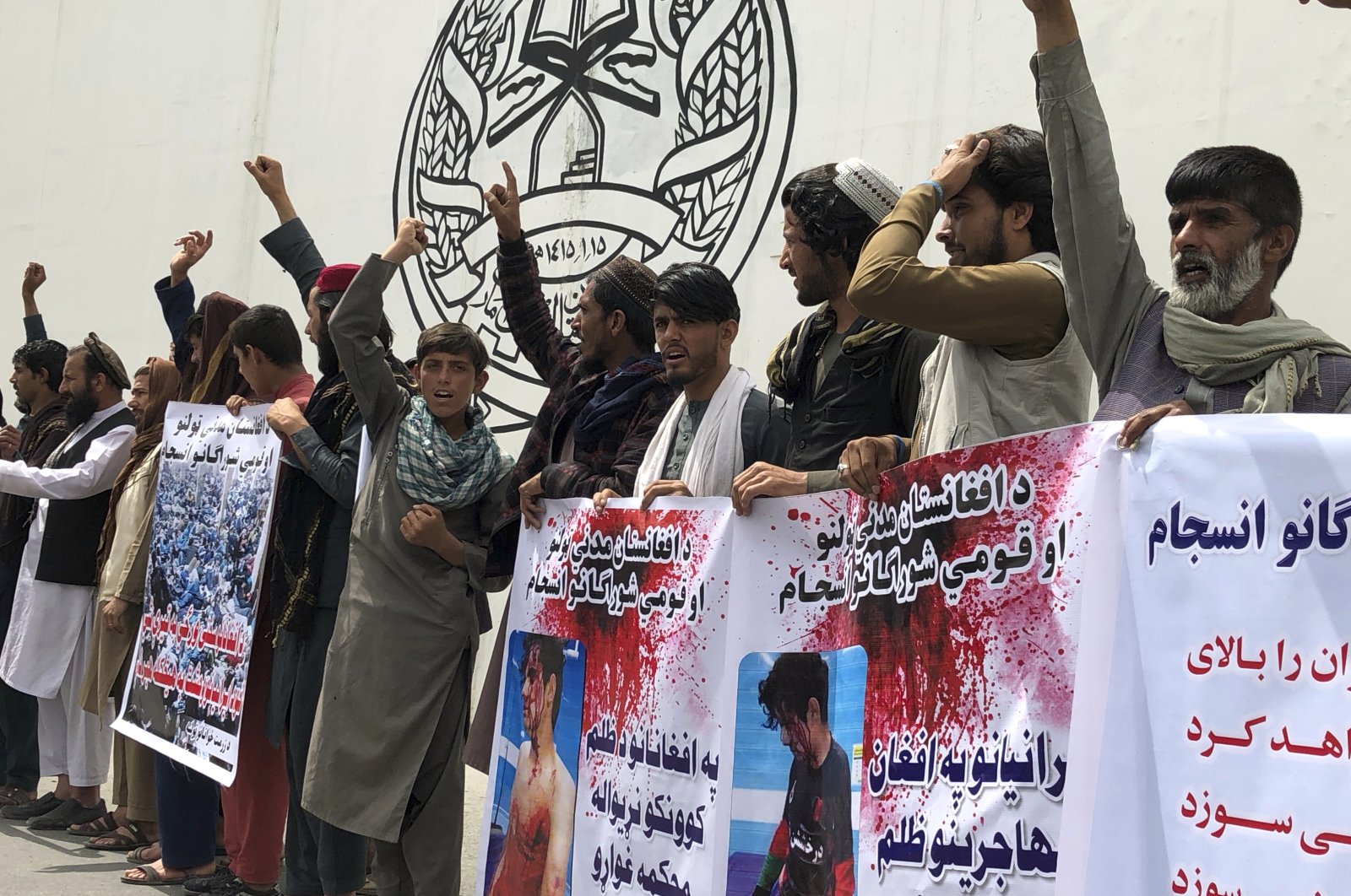 Afghans chant slogans against Iran during a demonstration in in Massoud Square, Kabul, Afghanistan, Tuesday, April 12, 2022. (AP Photo)