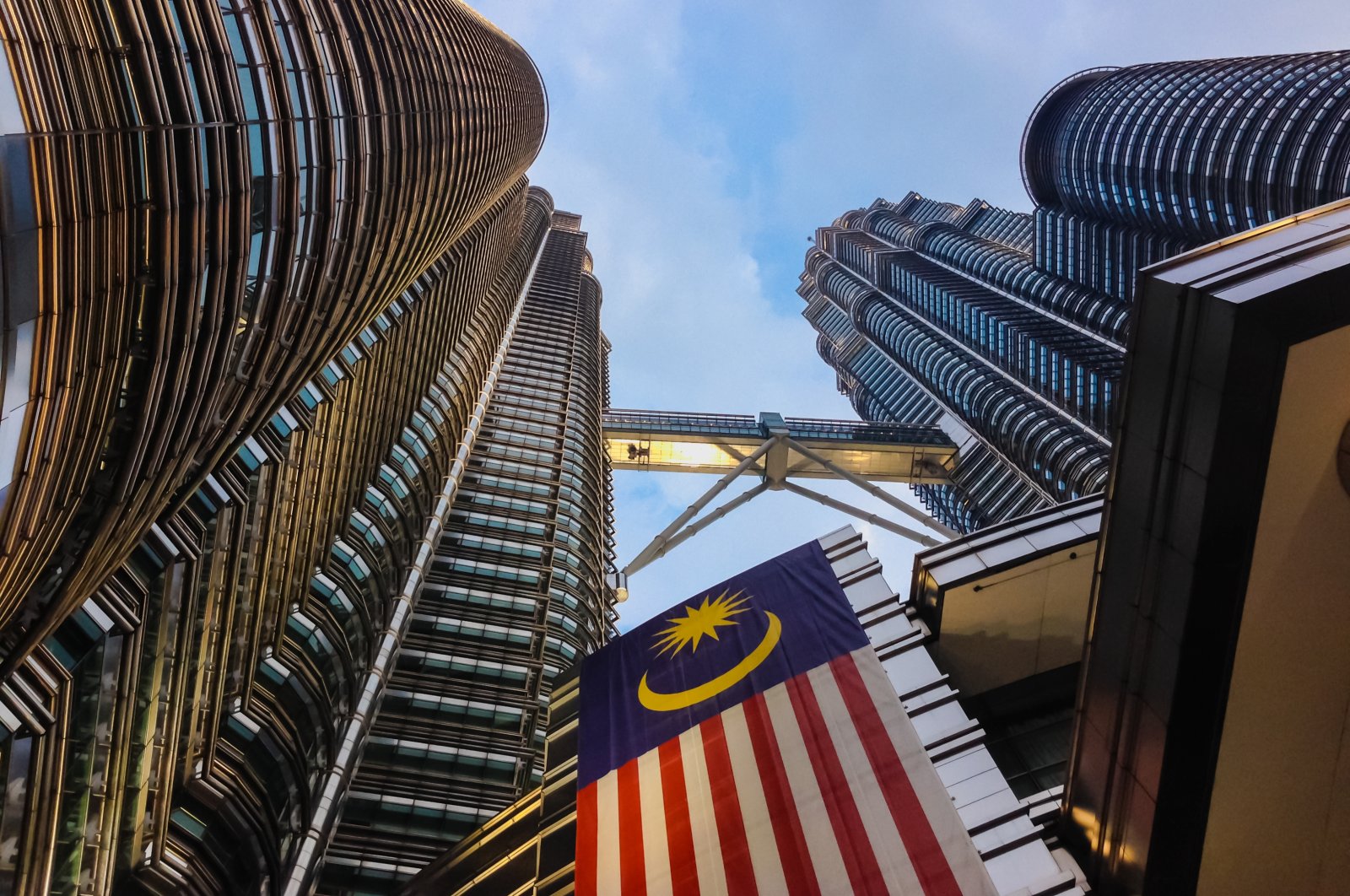 The Malaysian flag hangs from the Petronas Towers in Kuala Lumpur, Malaysia, Aug. 22, 2014. (Shutterstock Photo)