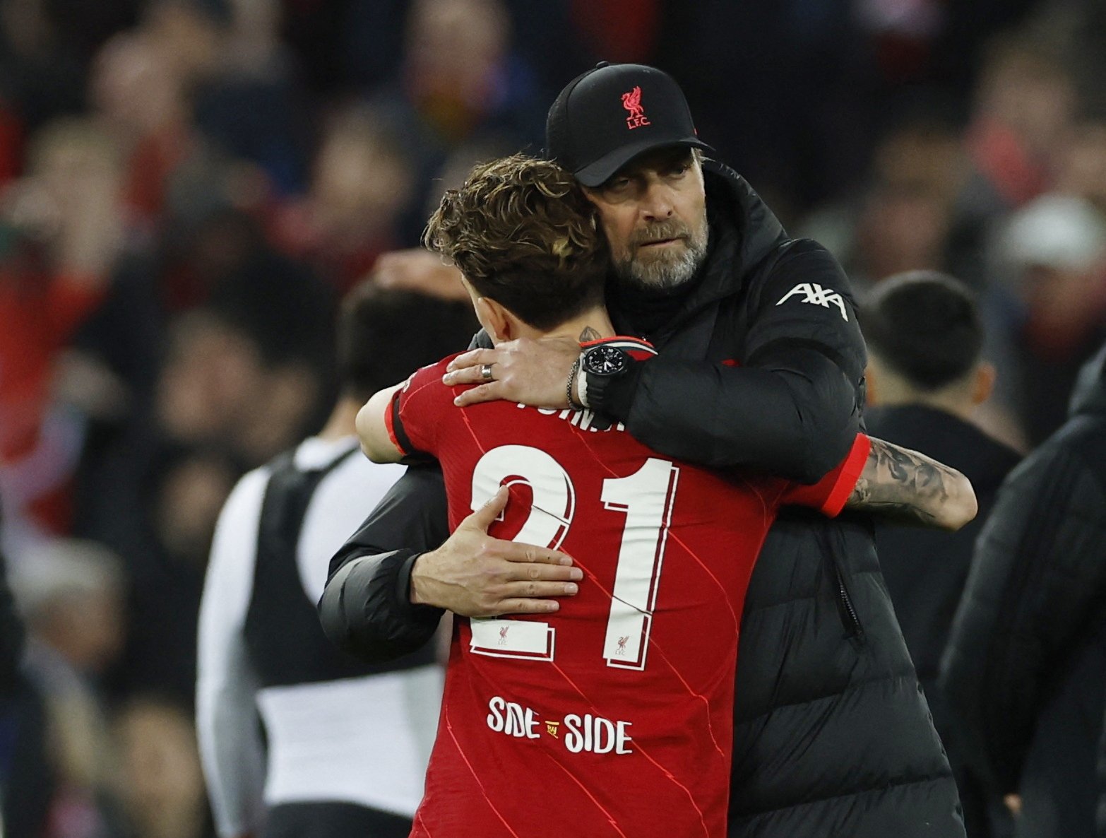 Liverpool manager Jürgen Klopp and Kostas Tsimikas celebrate after the Champions League quarterfinal second leg match between Liverpool and Benfica at Anfield, Liverpool, U.K., Apr. 13, 2022 (Action Images via Reuters/Jason Cairnduff)