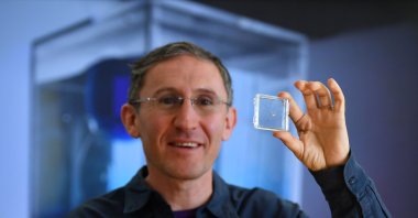 Bionaut Labs CEO and founder Michael Shpigelmacher displays various model of tiny remote-controlled medical micro-robots called Bionauts which his company is developing as a new modality for delivering treatments, in their lab in Los Angeles, California, March 17, 2022. (AFP Photo)