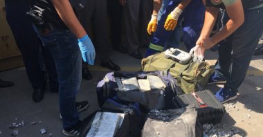 Customs officials check an intercepted cocaine shipment in Kocaeli, northwestern Turkey, Aug. 27, 2020. (AA PHOTO)