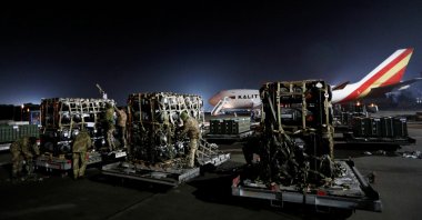 Ukrainian service members unpack Javelin anti-tank missiles, delivered by plane as part of the U.S. military support package for Ukraine, at the Boryspil International Airport outside Kyiv, Ukraine, on Feb. 10, 2022. (Reuters Photo)