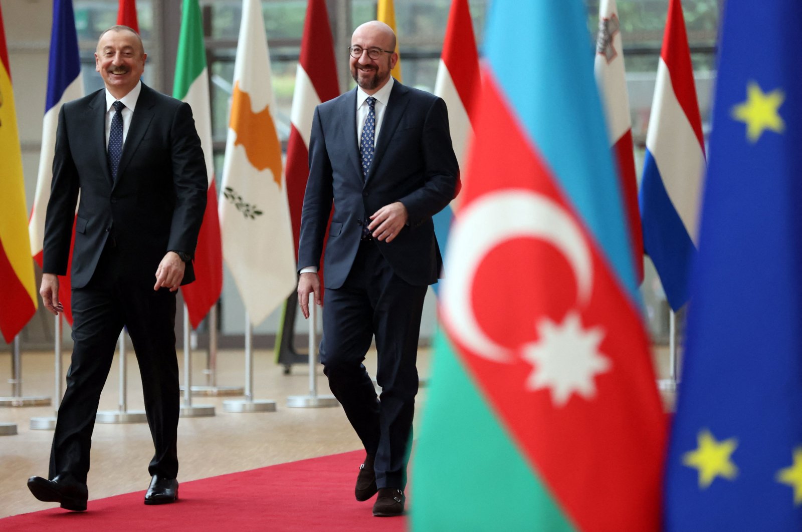 European Council President Charles Michel (R) walks with Azerbaijan President Ilham Aliyev as they arrive for a meeting at the European Council in Brussels, Belgium, April 6, 2022. (AFP Photo)