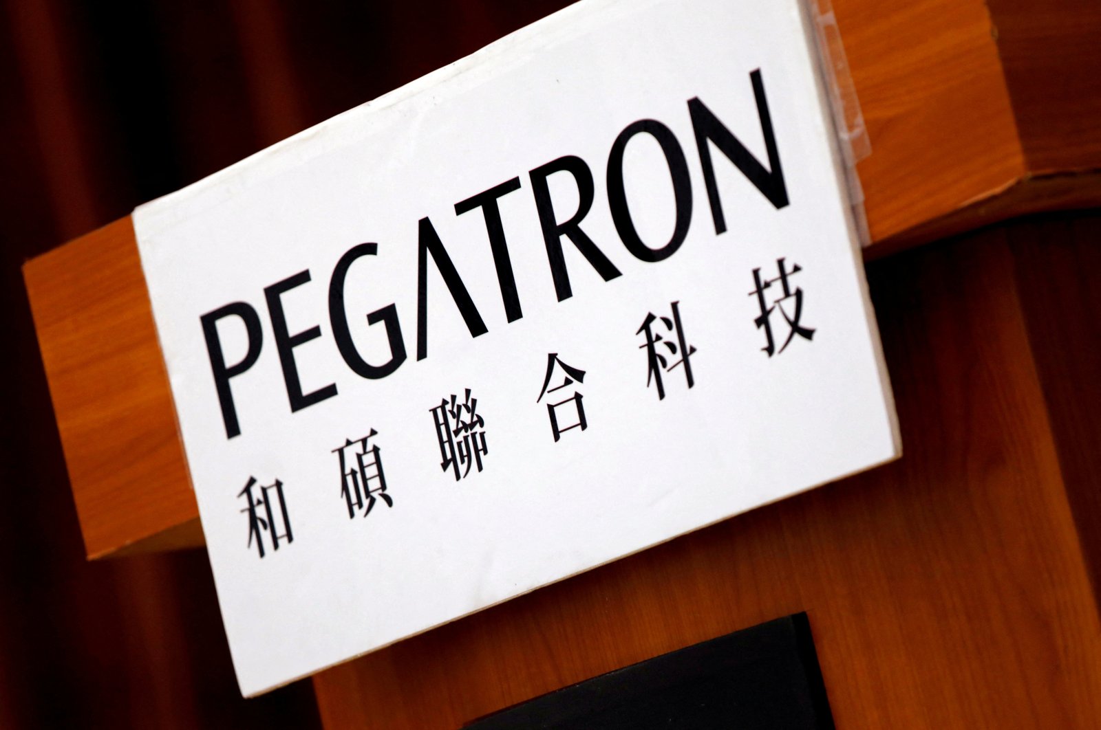 The logo of Pegatron, which assembles electronics from Apple Inc.’s iPhones, is seen during an annual general meeting in Taipei, Taiwan, June 20, 2017. (Reuters Photo)