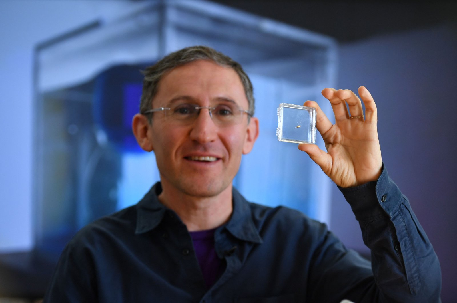 Bionaut Labs CEO and founder Michael Shpigelmacher displays various model of tiny remote-controlled medical micro-robots called Bionauts which his company is developing as a new modality for delivering treatments, in their lab in Los Angeles, California, March 17, 2022. (AFP Photo)