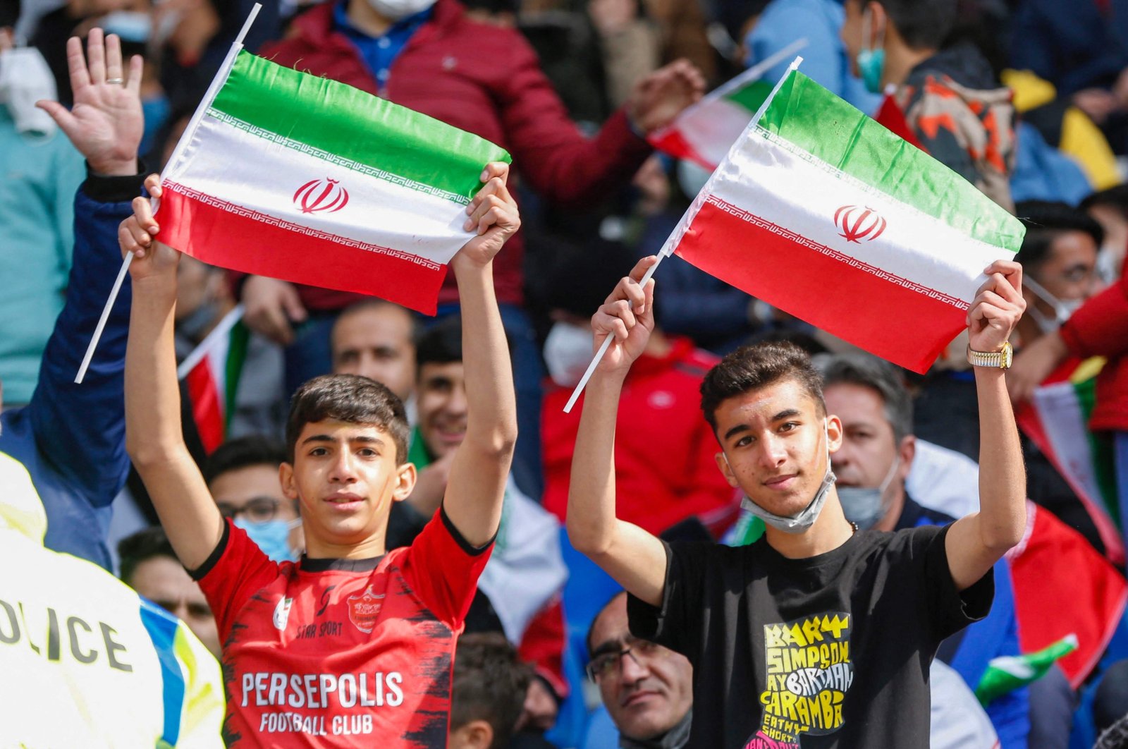 Iran supporters wave the national flag during the 2022 Qatar World Cup Asian Qualifiers football match against Lebanon, Mashhad, Iran, March 29, 2022. (AFP Photo)