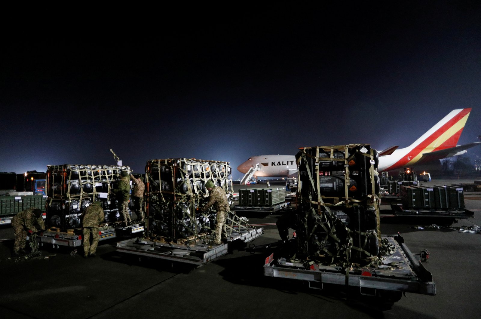 Ukrainian service members unpack Javelin anti-tank missiles, delivered by plane as part of the U.S. military support package for Ukraine, at the Boryspil International Airport outside Kyiv, Ukraine, on Feb. 10, 2022. (Reuters Photo)