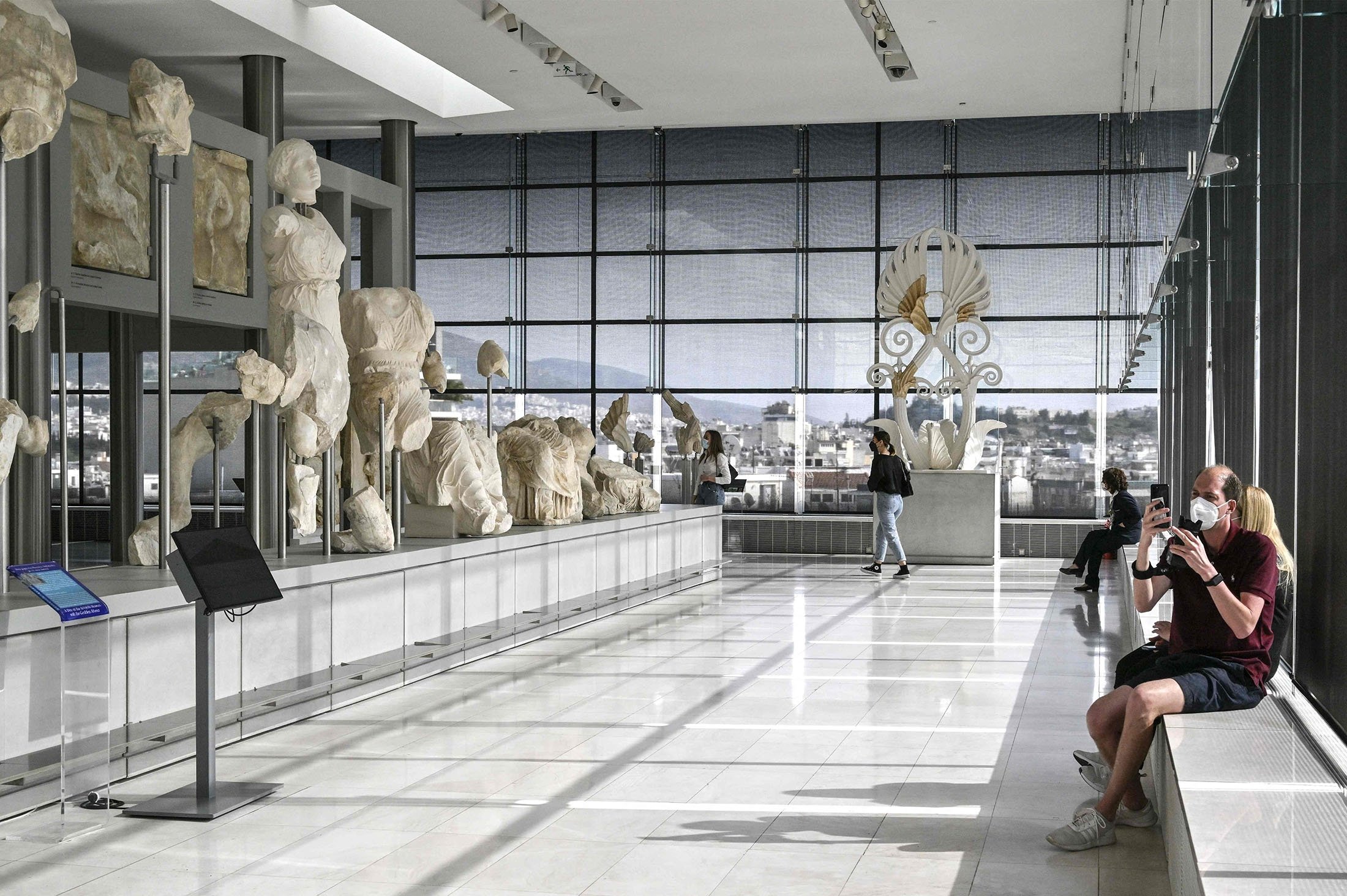 Visitors walk in the "Parthenon gallery" of the Acropolis museum in Athens, Greece, April 6, 2022. (AFP Photo)