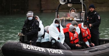 Migrants arrive into the Port of Dover onboard a Border Force vessel after being rescued while crossing the English Channel, Dover, Britain, Dec. 17, 2021. (Reuters Photo)