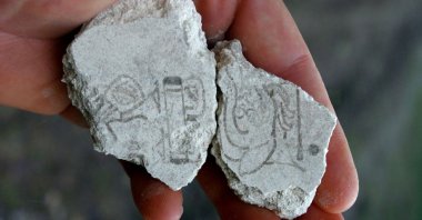 Two mural fragments dating to about 200 B.C. to 300 B.C., bearing evidence for the earliest use of the Maya calendar, from the San Bartolo Preclassic ancient Maya site in Guatemala. (Reuters Photo)
