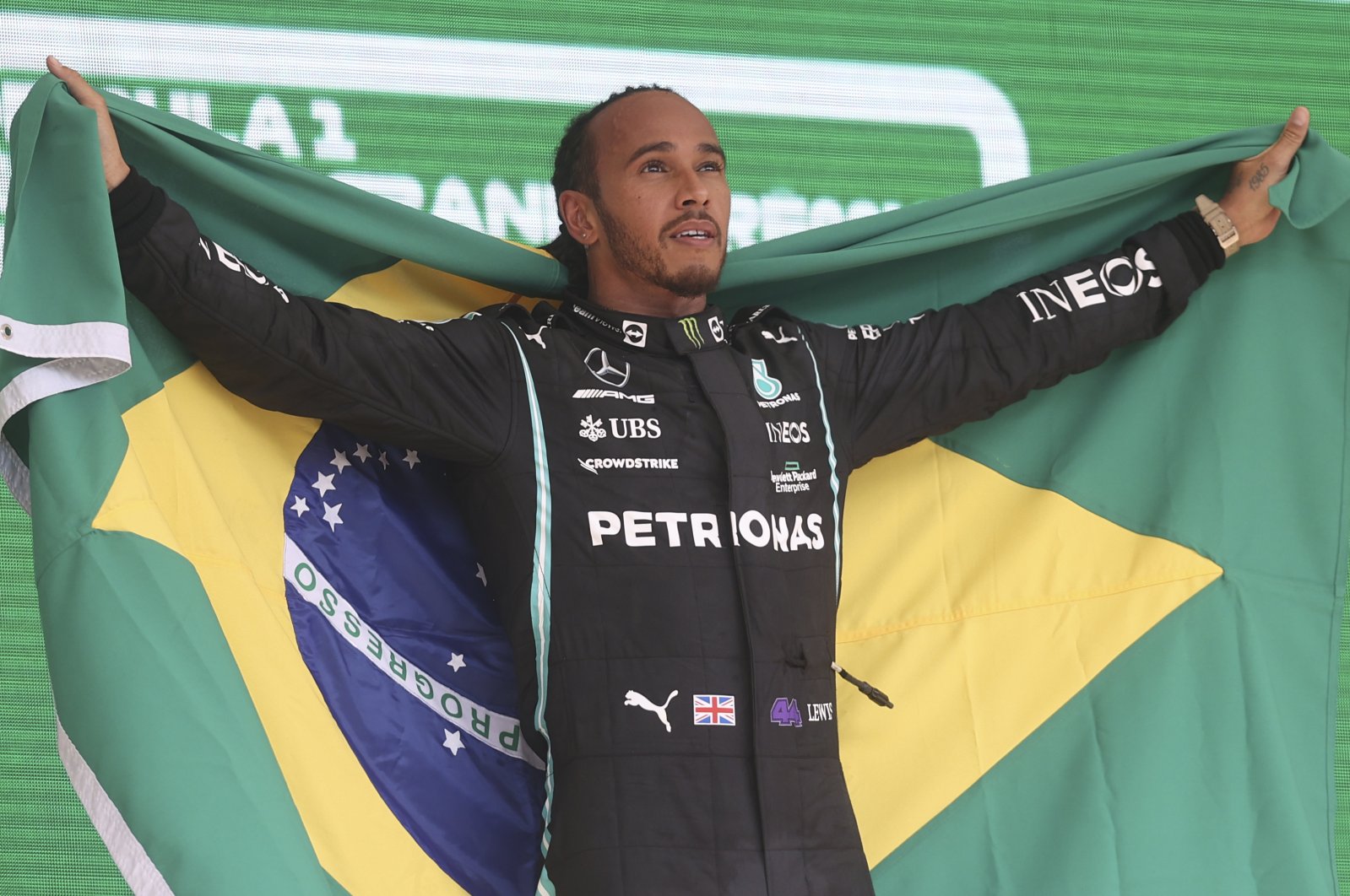 Mercedes driver Lewis Hamilton celebrates winning the Brazilian F1 GP, Sao Paulo, Brazil, Nov. 14, 2021. (AP Photo)
