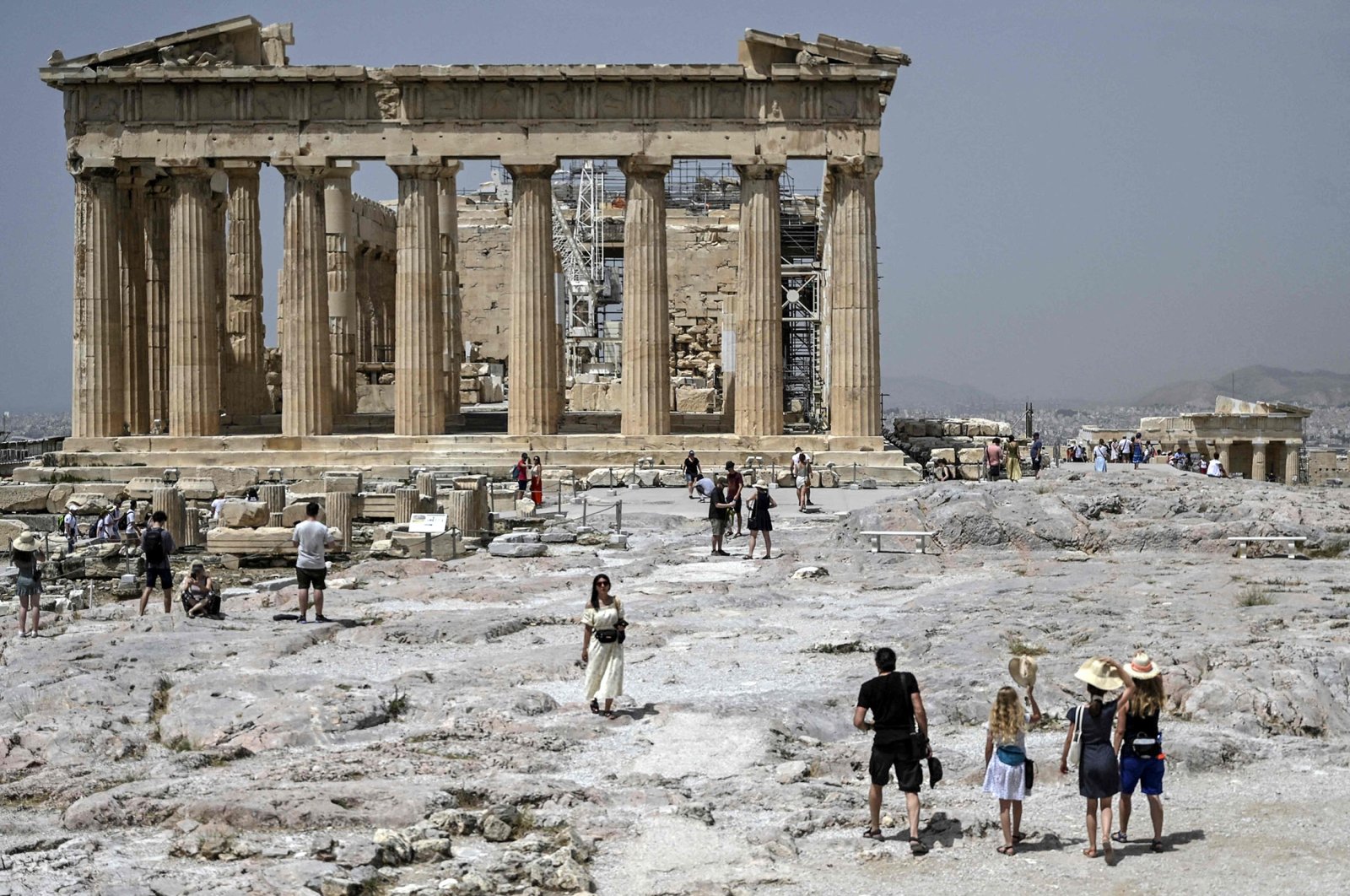 Visitors walk in front of the Parthenon Temple in Athens, Greece, April 6, 2022. (AFP Photo)