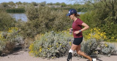 Marathoner Jacky Hunt-Broersma runs her 80th consecutive marathon on March 27, 2022. (AP Photo)
