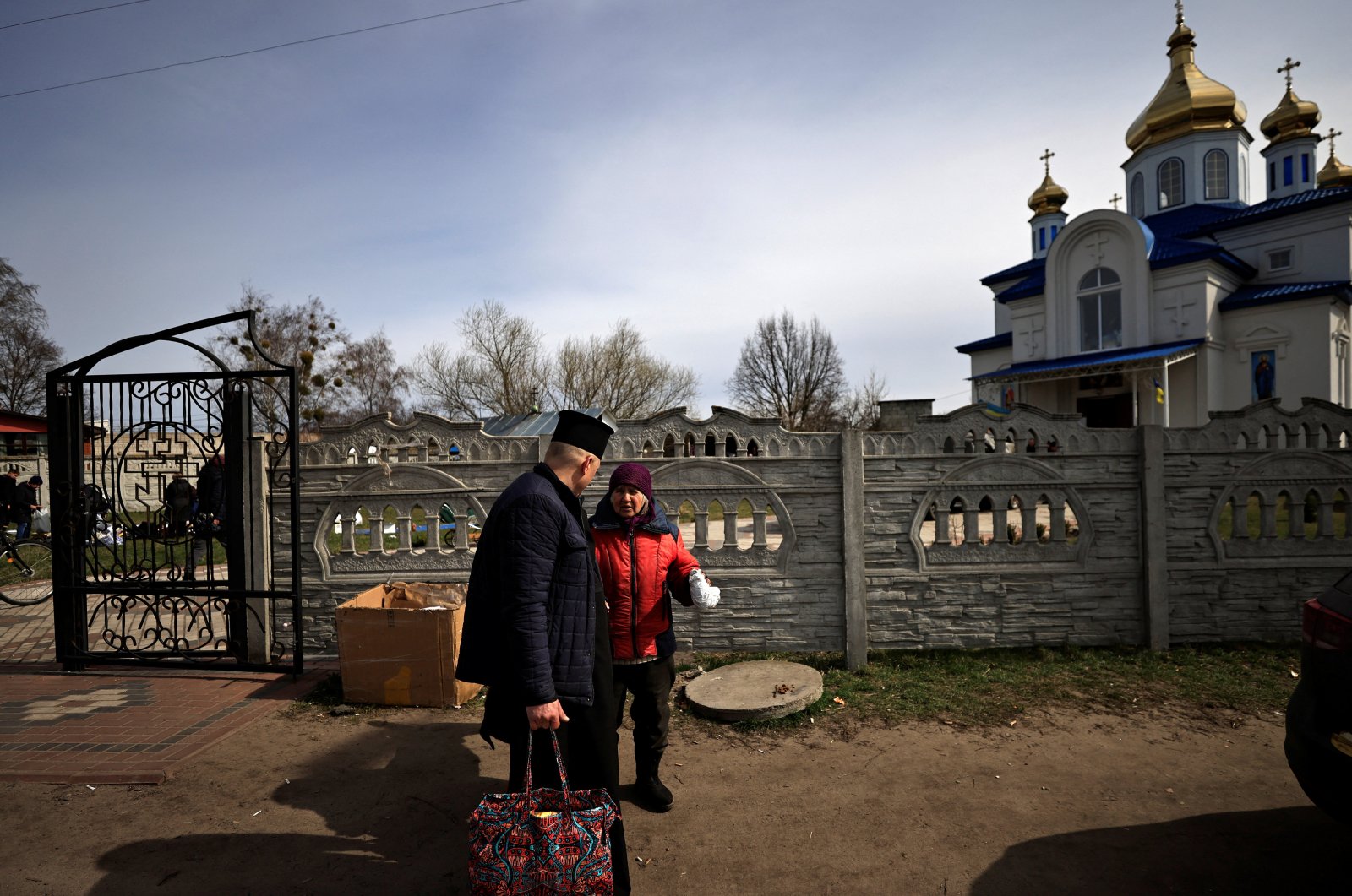 A family is seen amid Russia&#039;s invasion of Ukraine, in Borodyanka, Kyiv region, Ukraine, April 12, 2022. (REUTERS)