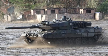 A Leopard 2 combat tank in action during the visit of German Minister of Defense Christine Lambrecht at the 9th Panzerlehr Brigade of the German Bundeswehr in Munster, northern Germany, Feb. 7, 2022. (EPA Photo)