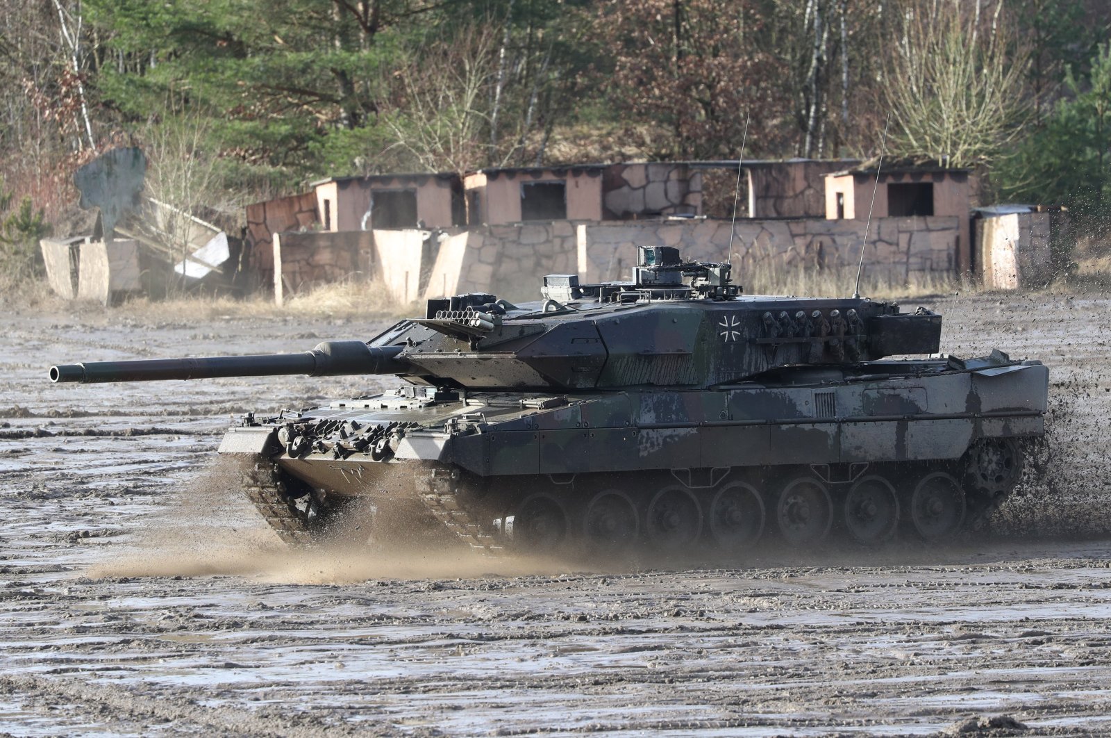 A Leopard 2 combat tank in action during the visit of German Minister of Defense Christine Lambrecht at the 9th Panzerlehr Brigade of the German Bundeswehr in Munster, northern Germany, Feb. 7, 2022. (EPA Photo)