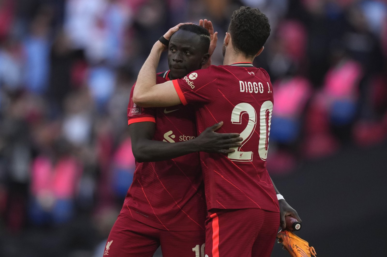 Liverpool&#039;s Sadio Mane (L) and Liverpool&#039;s Diogo Jota celebrate at the end of the English FA Cup semifinal soccer match between Manchester City and Liverpool at Wembley stadium in London, Saturday, April 16, 2022. (AP Photo)