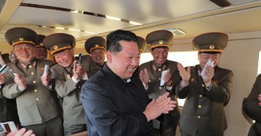 A photo released by the official North Korean Central News Agency (KCNA) shows Kim Jong Un (C), general secretary of the Workers' Party of Korea (WPK), president of the State Affairs of the Democratic People's Republic of Korea (DPRK) and supreme commander of the armed forces of the DPRK, as he watched the test-fire of a new-type tactical guided weapon from an undisclosed location, released on April 17, 2022.  (EPA Photo)