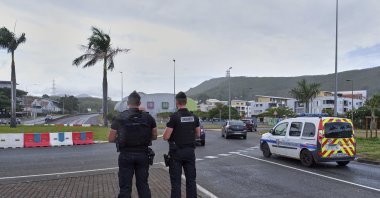 French gendarme patrol at a roundabout in Noumea, New Caledonia, Sunday, Dec.12, 2021. (AP File Photo)