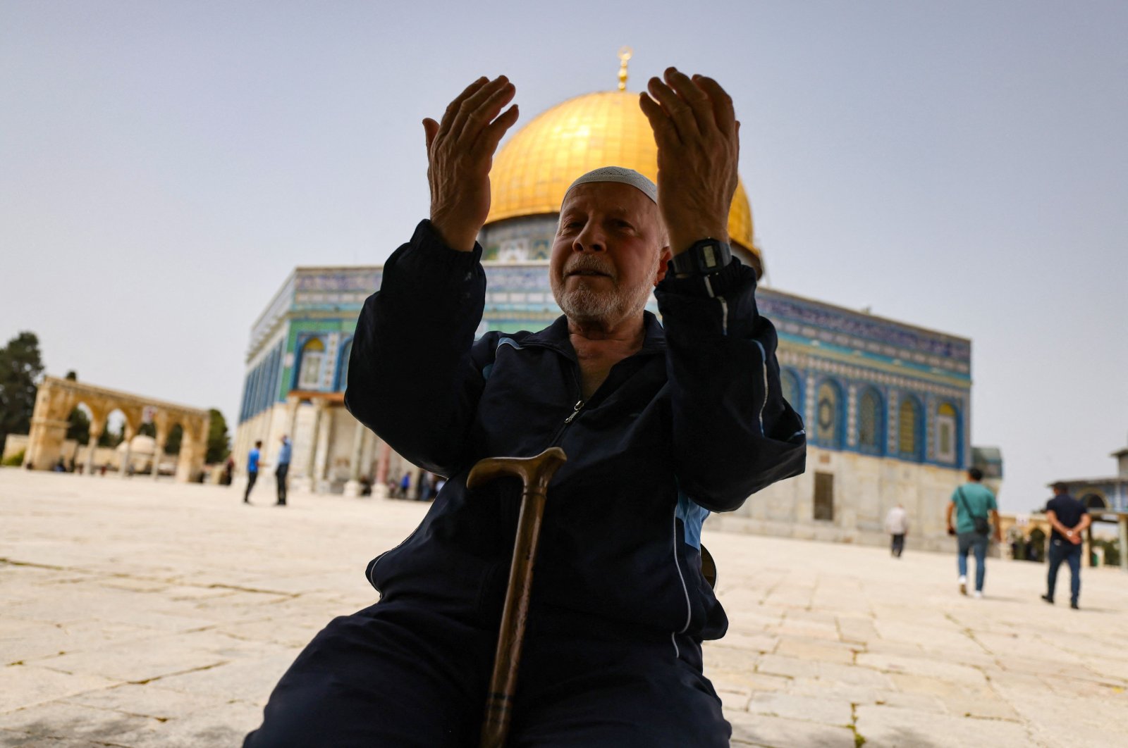 A Palestinian man prays in front of the Dome of Rock mosque at the al-Aqsa mosque compound in Jerusalem&#039;s Old City on April 17, 2022. (AFP Photo)