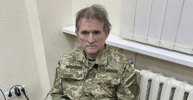 Oligarch Viktor Medvedchuk, who is both the former leader of a pro-Russian opposition party and a close associate of Russian leader Vladimir Putin, sits handcuffed after being detained in a special operation carried out by the country's SBU secret service, Ukraine, April 12, 2022. (AP Photo)