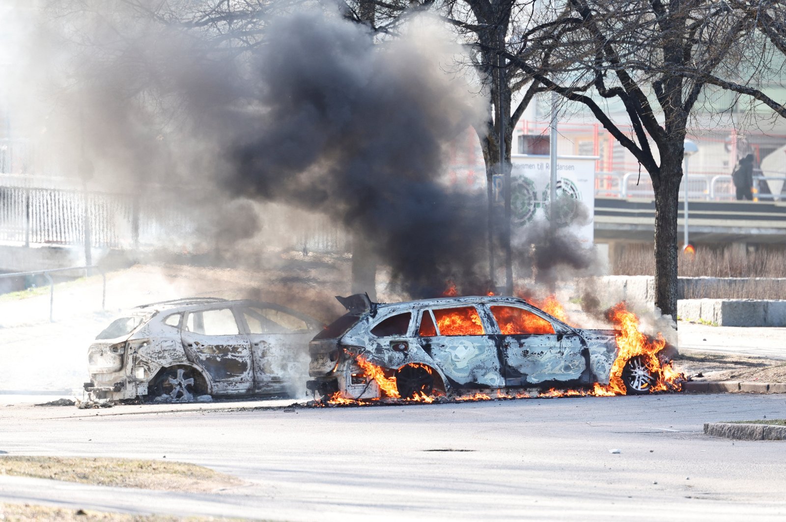 Two cars are burning in a parking during a riot ahead of a demonstration planned by Danish anti-Muslim politician Rasmus Paludan, Norrkoping, Sweden, April 17, 2022. (Reuters Photo)