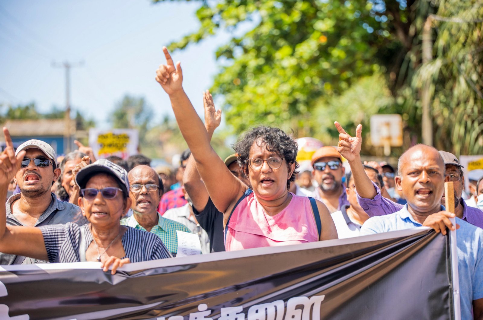 Leftist People&#039;s Liberation Front (JVP) activists participate in a march demanding the resignation of President Gotabaya Rajapaksa from the southern town of Beruwala, Sri Lanka, April 17, 2022. (AFP Photo)