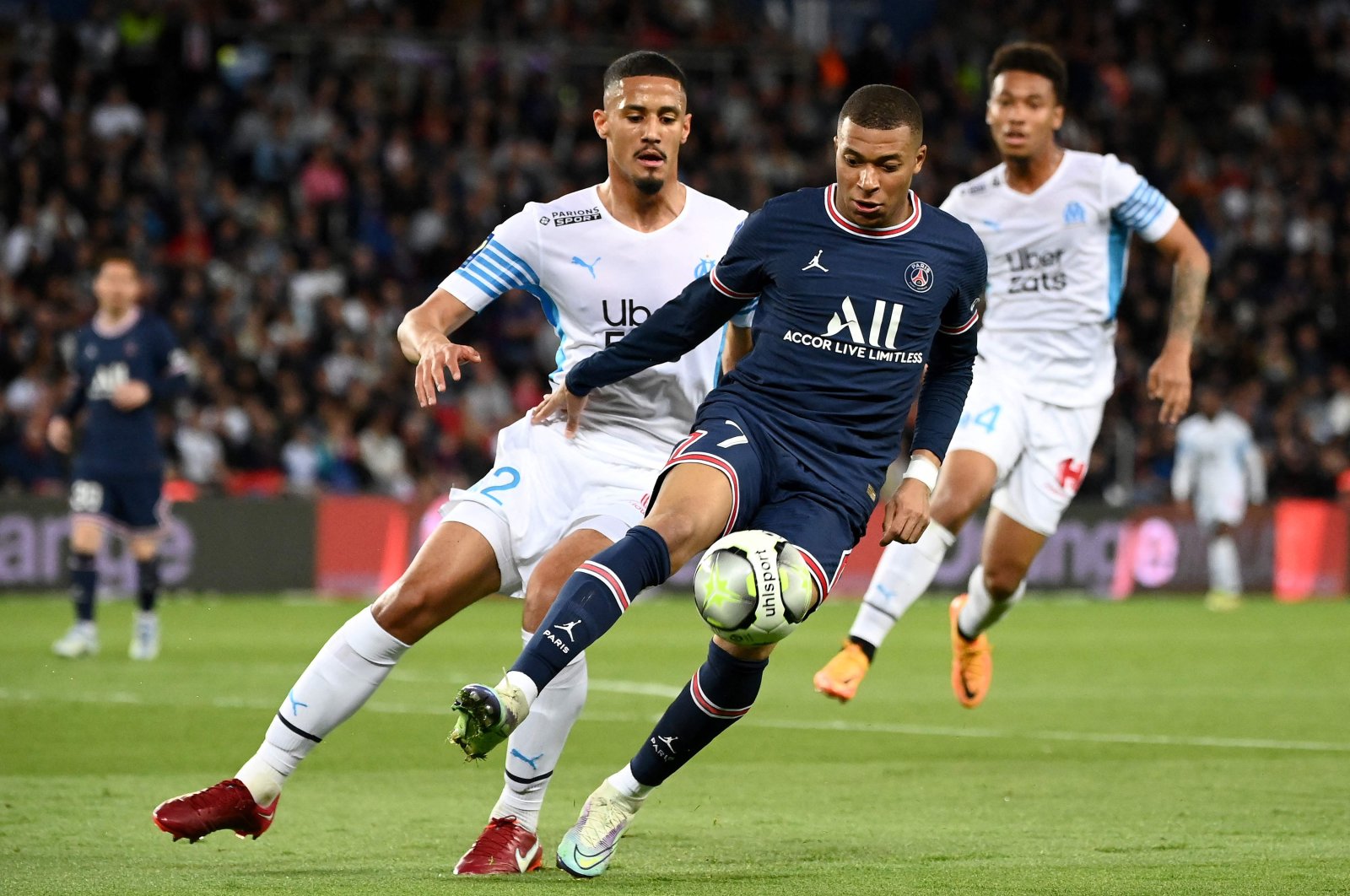 PSG&#039;s Kylian Mbappe (L) controls the ball next to Marseille&#039;s William Saliba in a French L1 match, Paris, France, April 17, 2022. (AFP Photo)