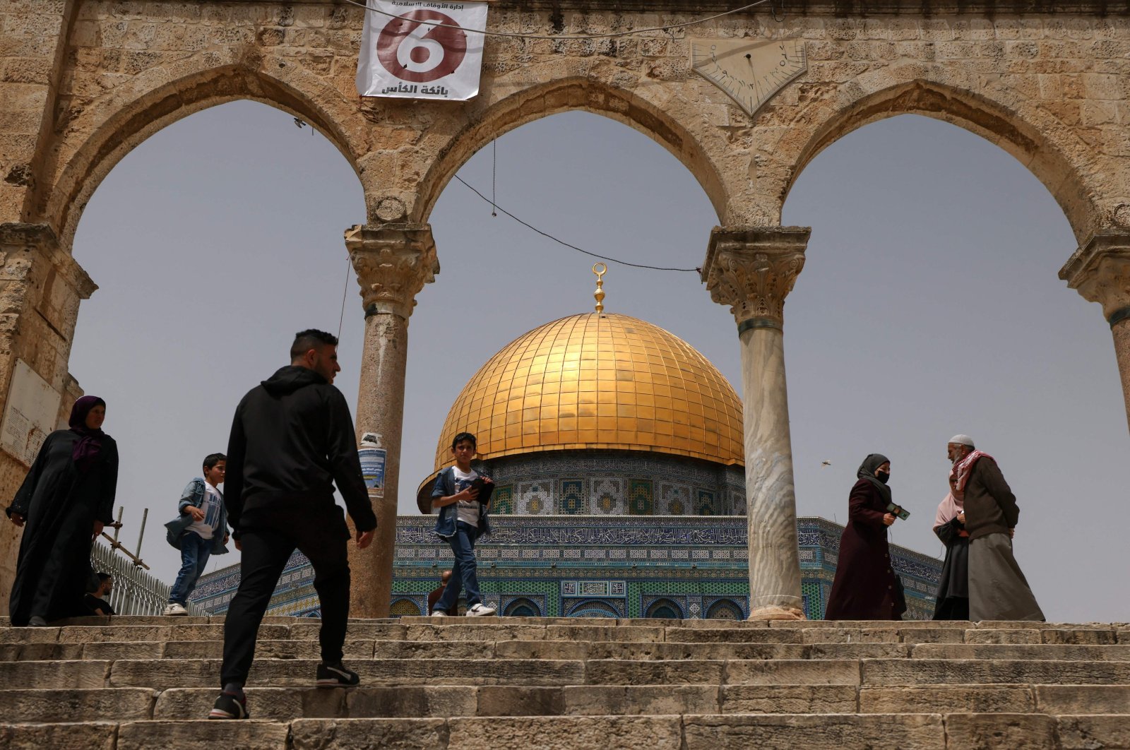 Palestinian Muslims gather in front of the Dome of Rock mosque at the al-Aqsa mosque compound in Jerusalem&#039;s Old City on April 17, 2022. (AFP Photo)