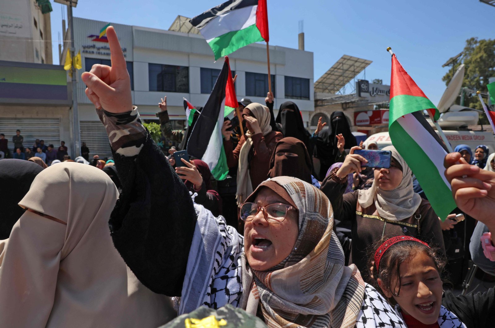 Supporters of the Palestinian Hamas movement rally after Friday prayers in Gaza City on April 15, 2022, following clashes at Jerusalem&#039;s Aqsa mosque compound. (AFP Photo)