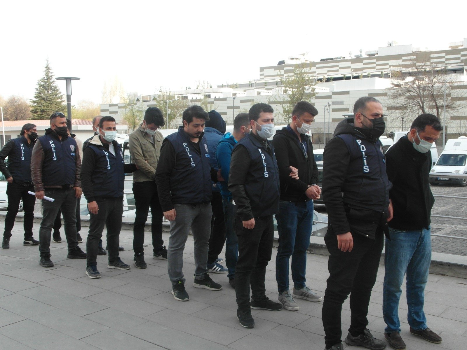 Police officers escort captured FETÖ suspects in the capital Ankara, Turkey, April 19, 2022. (AA Photo)