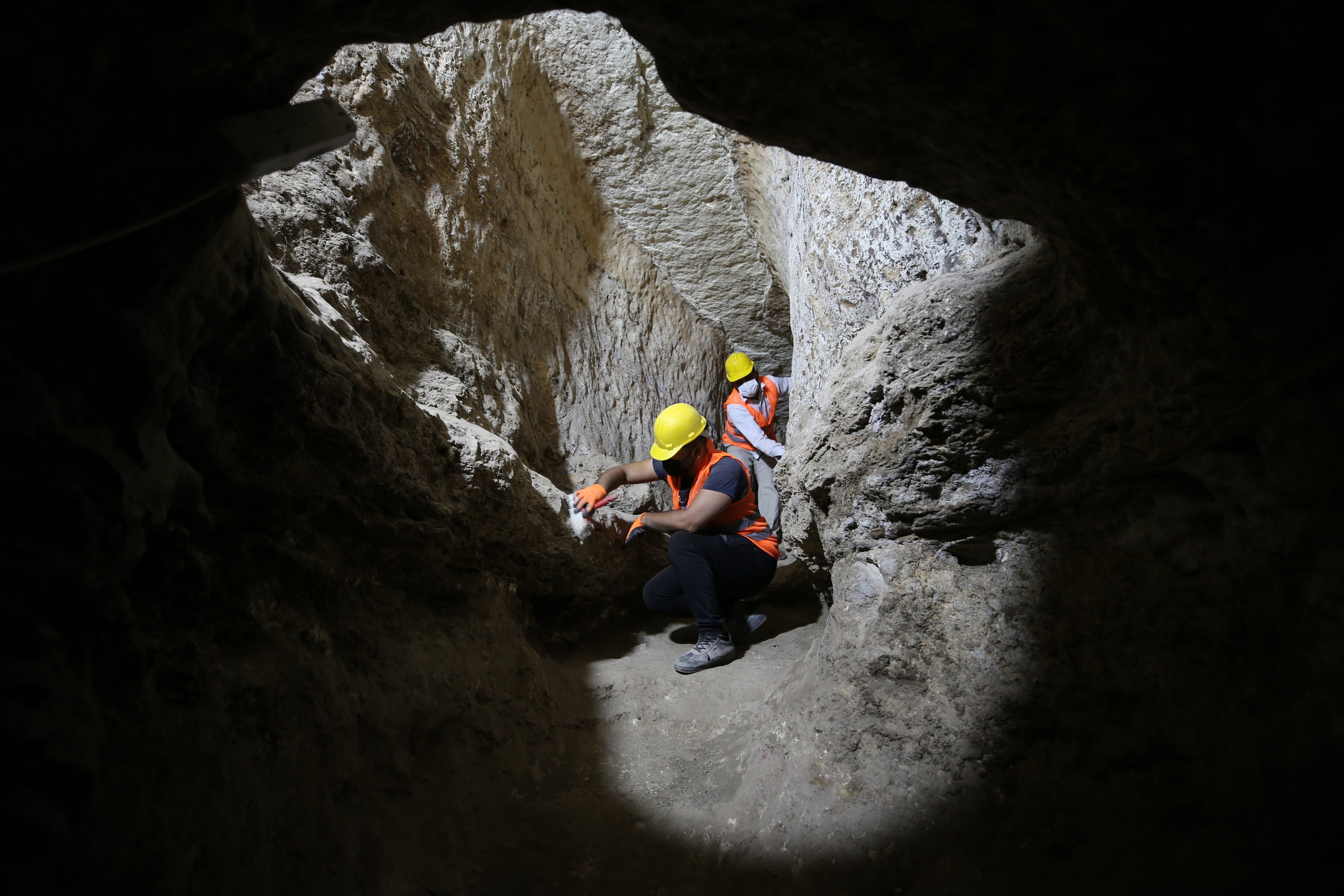 Experts work in the underground city in Midyat, Mardin, southeastern Turkey, Apr. 18, 2022. (AA) 