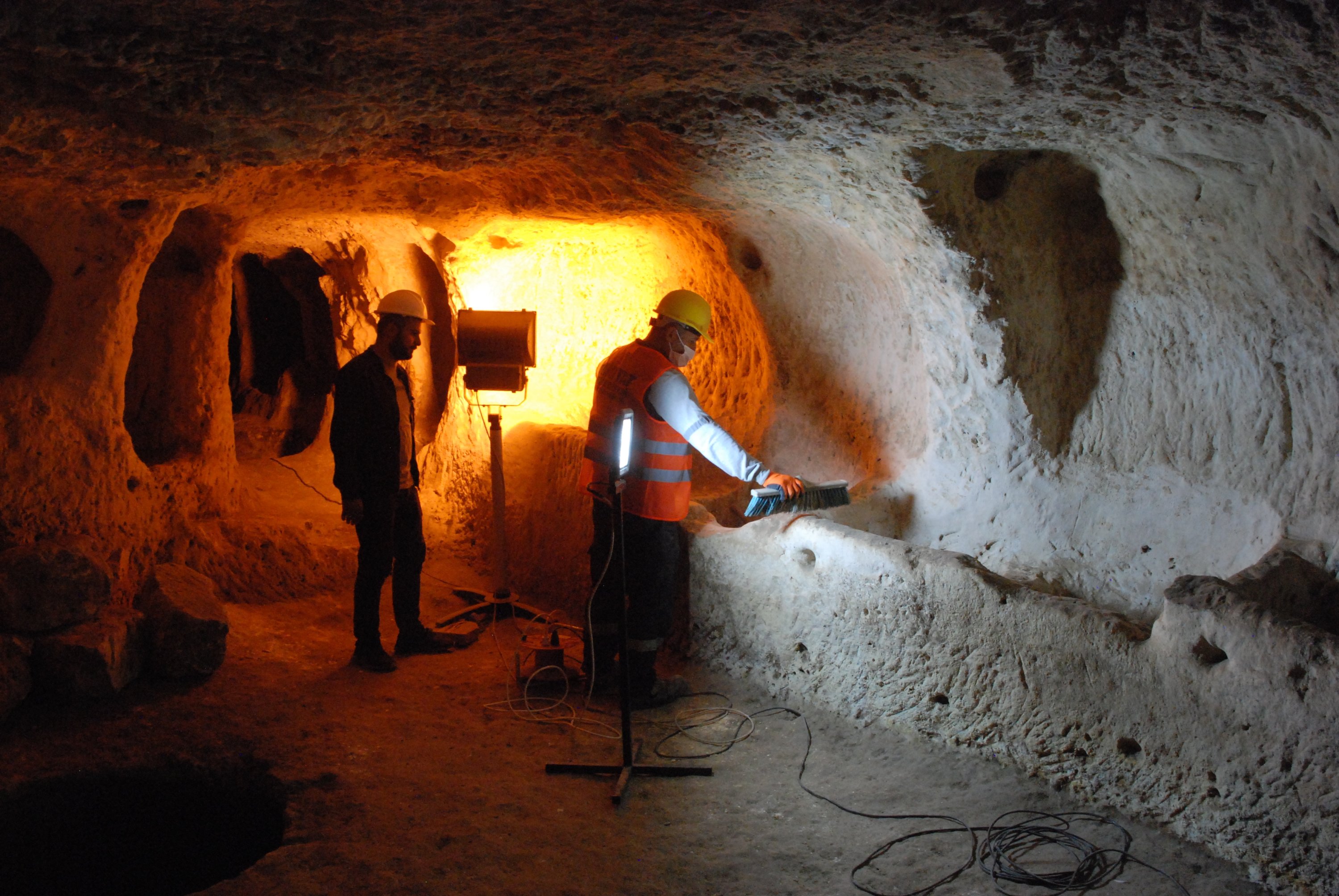Experts work in the underground city in Midyat, Mardin, southeastern Turkey, Apr. 18, 2022. (AA) 