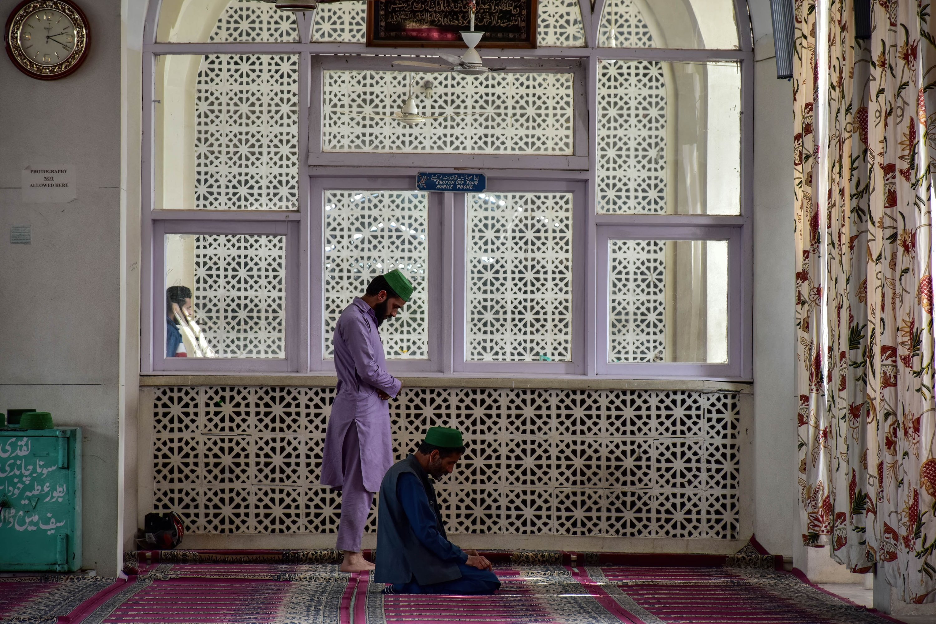 Kashmiri Muslims offer noon prayers inside the Hazratbal Shrine, Kashmir during the ongoing month of Ramadan. (REUTERS)