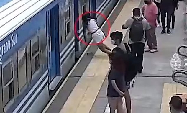 Security camera footage shows a woman collapsing on the platform at a train station near Buenos Aires, Argentina, March 29, 2022. 