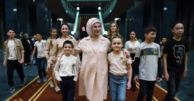 First lady Emine Erdoğan walks with Ukrainian children who sought refuge in Turkey during a dinner at the Presidential Complex in Ankara, Turkey, April 18, 2022. (AA Photo)